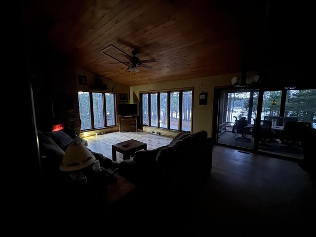 1948 Wild Life Ln, Eagle River, WI 54521 - living room with wood ceiling, ceiling fan, a fireplace, and vaulted ceiling