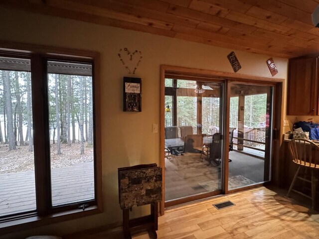 1948 Wild Life Ln, Eagle River, WI 54521 - doorway featuring light wood finished floors, french doors, wooden ceiling, and ceiling fan