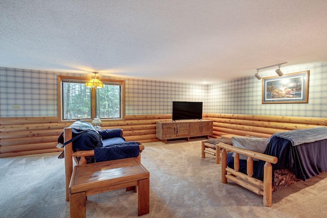 1948 Wild Life Ln, Eagle River, WI 54521 - carpeted living room featuring wallpapered walls, log walls, and a textured ceiling