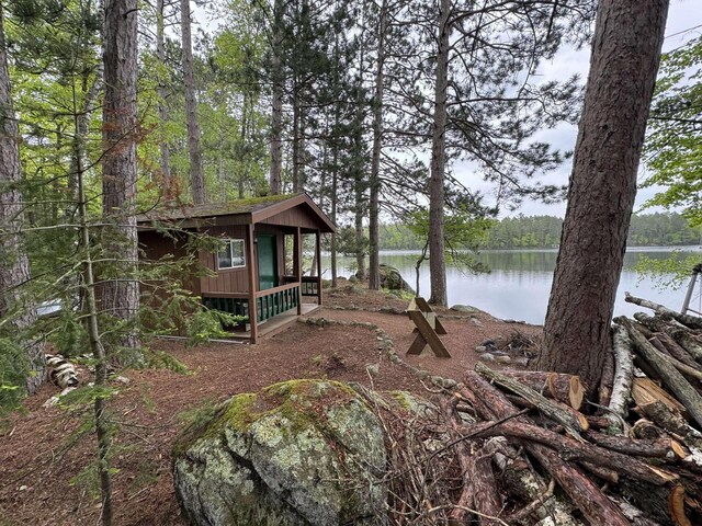 1948 Wild Life Ln, Eagle River, WI 54521 - view of yard featuring a water view, an outdoor structure, and a forest view