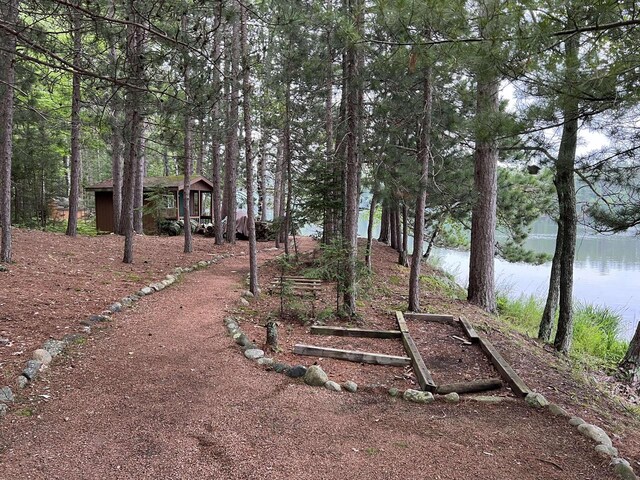 1948 Wild Life Ln, Eagle River, WI 54521 - view of yard with a water view and an outbuilding