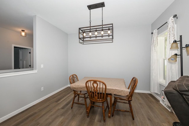 5150 Fairmont Dr, Milton, WI 53563 - dining space featuring dark wood-type flooring and baseboards