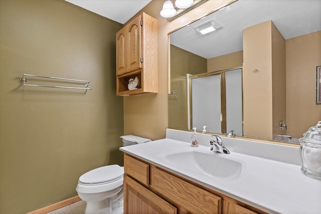 267 Oconomowoc Pkwy, Oconomowoc, WI 53066 - bathroom featuring a shower stall, toilet, vanity, and tile patterned floors
