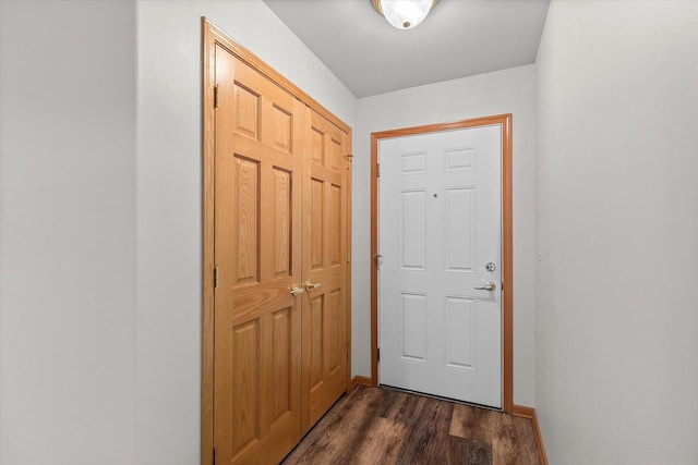 267 Oconomowoc Pkwy, Oconomowoc, WI 53066 - doorway to outside featuring dark wood-type flooring and baseboards