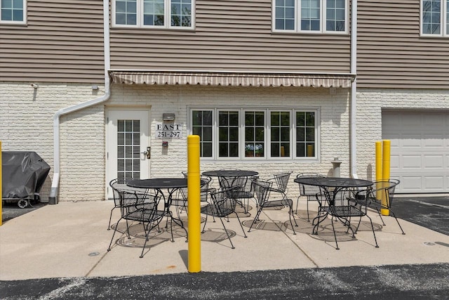 267 Oconomowoc Pkwy, Oconomowoc, WI 53066 - view of patio featuring a grill and outdoor dining area