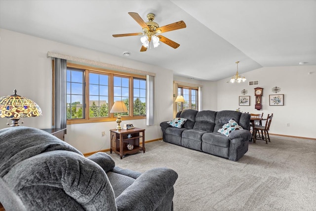 267 Oconomowoc Pkwy, Oconomowoc, WI 53066 - carpeted living area featuring a chandelier, vaulted ceiling, baseboards, and a ceiling fan