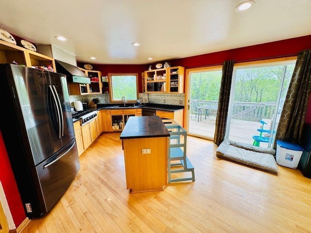 N5893 Walnut Rd, Monticello, WI 53570 - kitchen with open shelves, freestanding refrigerator, dark countertops, wall chimney range hood, and recessed lighting