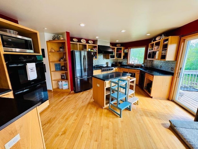N5893 Walnut Rd, Monticello, WI 53570 - kitchen with open shelves, black appliances, range hood, a sink, and dark countertops