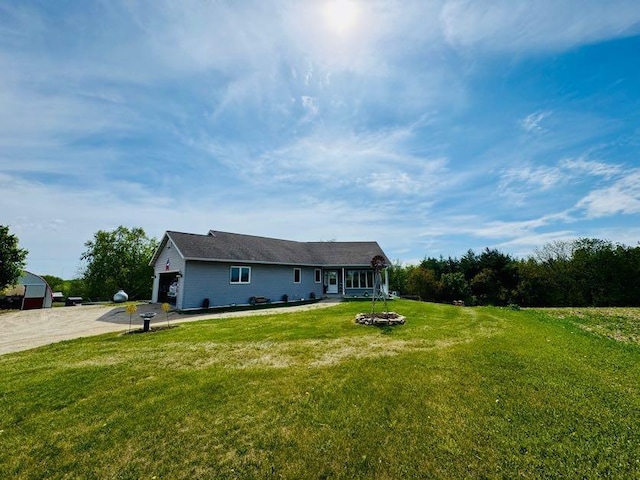 N5893 Walnut Rd, Monticello, WI 53570 - view of front of house featuring a front lawn and an attached garage