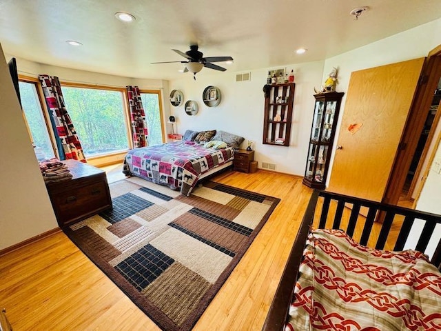 N5893 Walnut Rd, Monticello, WI 53570 - bedroom featuring wood finished floors, recessed lighting, ceiling fan, and baseboards