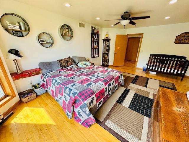 N5893 Walnut Rd, Monticello, WI 53570 - bedroom featuring wood-type flooring, recessed lighting, and ceiling fan