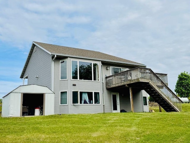 N5893 Walnut Rd, Monticello, WI 53570 - back of house featuring a wooden deck, a lawn, stairs, and an outbuilding