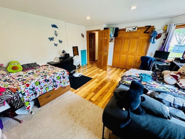 N5893 Walnut Rd, Monticello, WI 53570 - bedroom with light wood-type flooring, a closet, and recessed lighting
