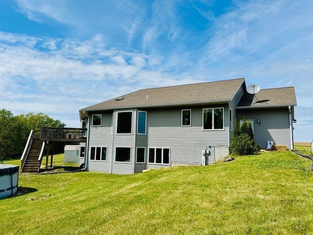 N5893 Walnut Rd, Monticello, WI 53570 - back of house with stairway, a lawn, and a deck