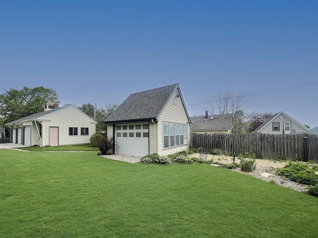 view of yard with an outdoor structure and a garage