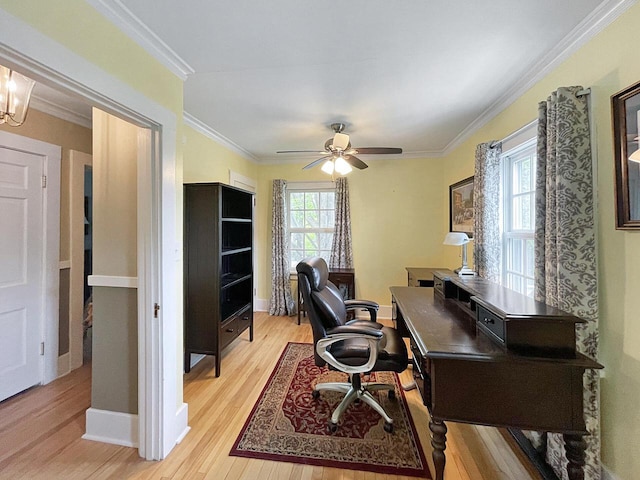 office area with light wood-style floors, crown molding, ceiling fan, and baseboards