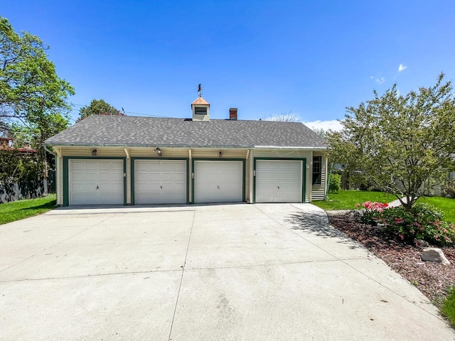 view of front of house with a chimney and a shingled roof