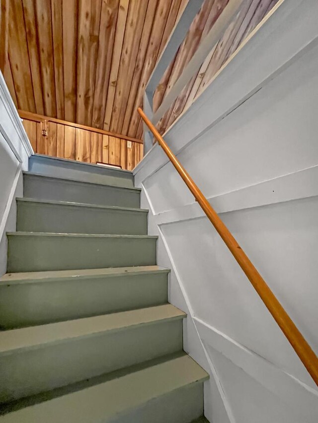 stairway featuring wood ceiling