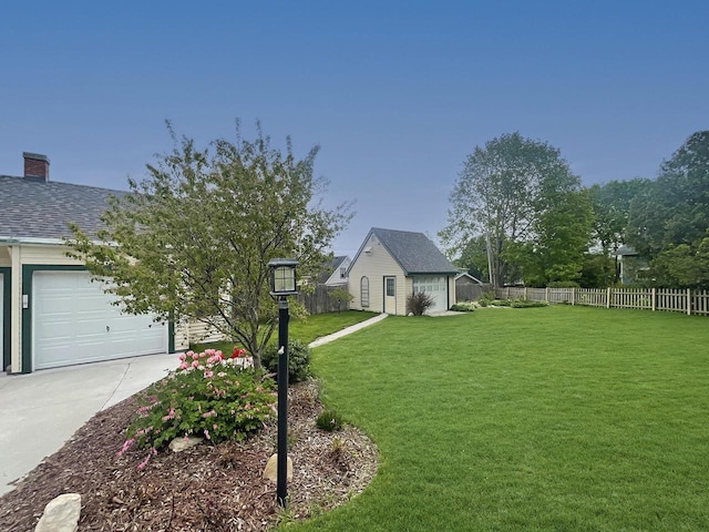 view of front of property featuring concrete driveway, a chimney, an outdoor structure, and an attached garage
