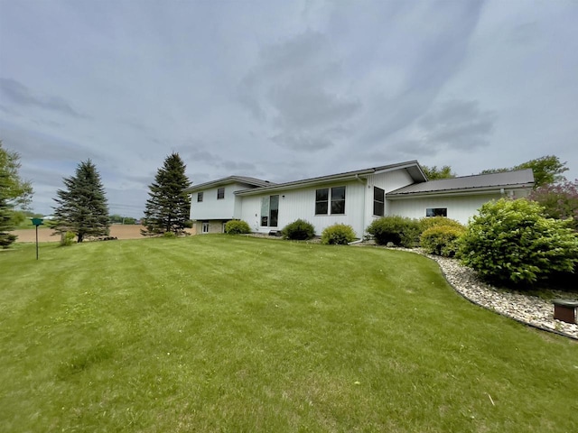 7401 Mildred Ct, Cross Plains, WI 53528 - rear view of property with a yard