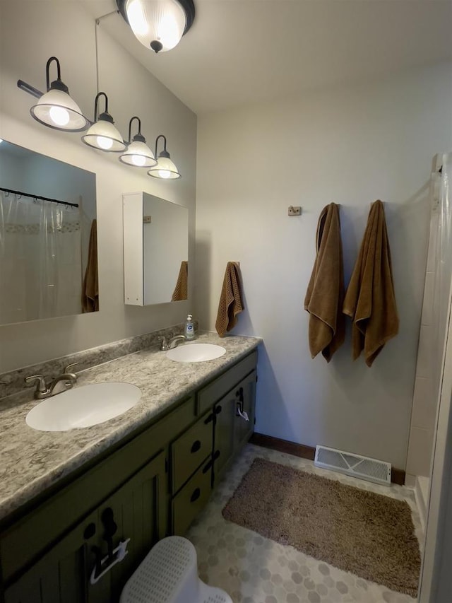 7401 Mildred Ct, Cross Plains, WI 53528 - full bath with double vanity, a shower with curtain, and baseboards