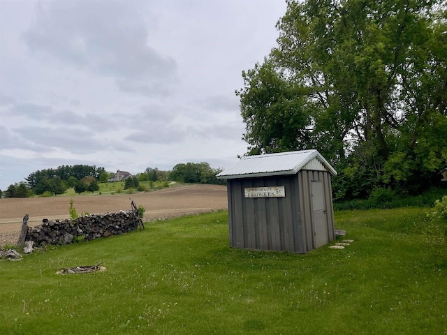 7401 Mildred Ct, Cross Plains, WI 53528 - view of green lawn featuring a storage unit and an outdoor structure