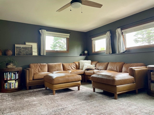 7401 Mildred Ct, Cross Plains, WI 53528 - carpeted living area featuring healthy amount of natural light and ceiling fan