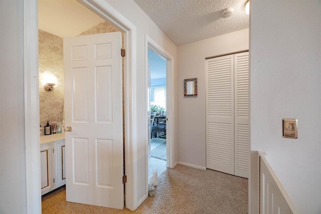 14 Golf Course Rd, Madison, WI 53704 - hall featuring light colored carpet, a textured ceiling, and baseboards
