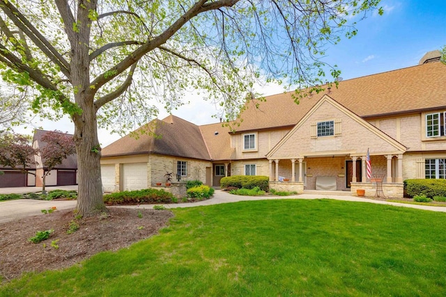14 Golf Course Rd, Madison, WI 53704 - view of front of property featuring a front yard, an attached garage, and driveway