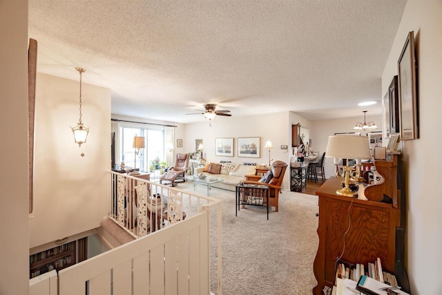 14 Golf Course Rd, Madison, WI 53704 - living room featuring a textured ceiling, carpet floors, ceiling fan, and a chandelier