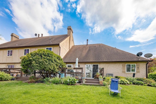 14 Golf Course Rd, Madison, WI 53704 - back of property featuring a yard, stucco siding, a chimney, and a wooden deck
