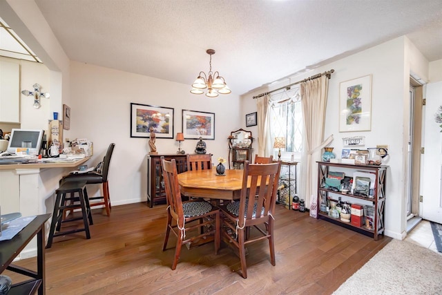 14 Golf Course Rd, Madison, WI 53704 - dining room with an office area, wood finished floors, a chandelier, and baseboards