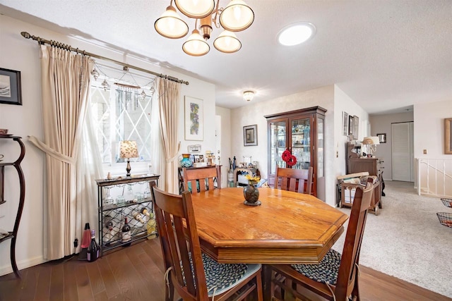 14 Golf Course Rd, Madison, WI 53704 - dining area featuring dark wood-type flooring, healthy amount of natural light, a chandelier, and a textured ceiling