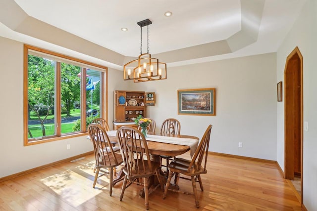 1816 Blue Ridge Trl, Waunakee, WI 53597 - dining area featuring light wood finished floors, a chandelier, baseboards, recessed lighting, and a tray ceiling