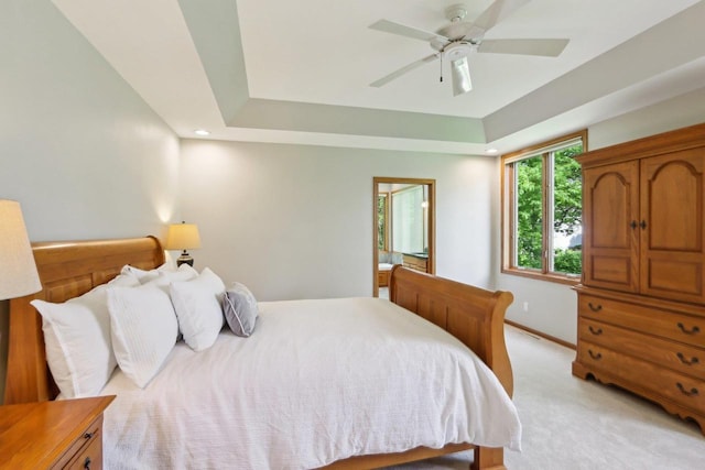 1816 Blue Ridge Trl, Waunakee, WI 53597 - bedroom featuring light carpet, baseboards, a tray ceiling, and a ceiling fan