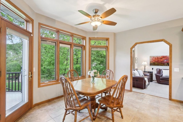 1816 Blue Ridge Trl, Waunakee, WI 53597 - dining space with plenty of natural light, baseboards, a ceiling fan, and light tile patterned floors