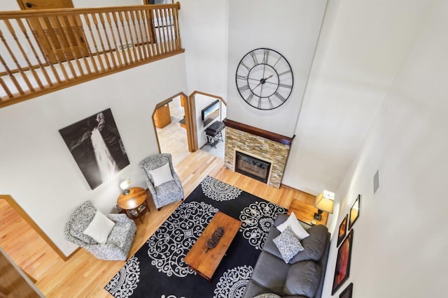 1816 Blue Ridge Trl, Waunakee, WI 53597 - living room with a towering ceiling, wood finished floors, and a fireplace
