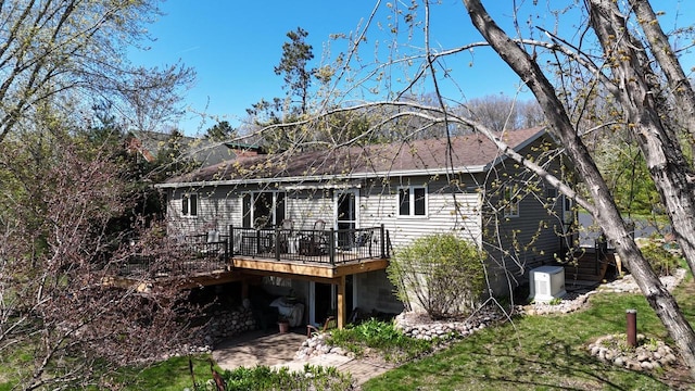 N1423 Silver Canoe Rd, Keshena, WI 54135 - back of property featuring a wooden deck and a shingled roof