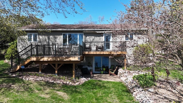 N1423 Silver Canoe Rd, Keshena, WI 54135 - back of house featuring a deck, stairs, a patio area, and a yard