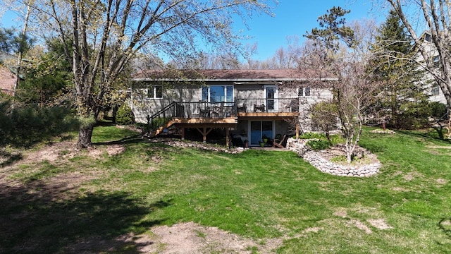 N1423 Silver Canoe Rd, Keshena, WI 54135 - back of property with a wooden deck, a yard, and stairs