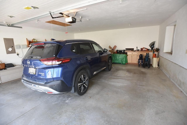 N1423 Silver Canoe Rd, Keshena, WI 54135 - garage with a garage door opener and electric panel
