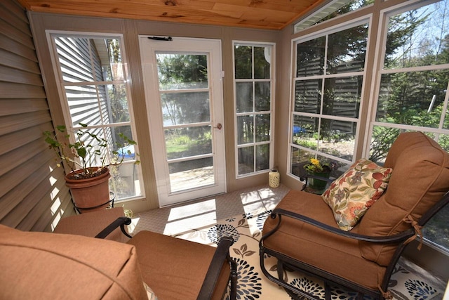 N1423 Silver Canoe Rd, Keshena, WI 54135 - sunroom with carpet flooring, vaulted ceiling, healthy amount of natural light, and wood ceiling