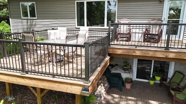 N1423 Silver Canoe Rd, Keshena, WI 54135 - deck with outdoor dining space and a patio