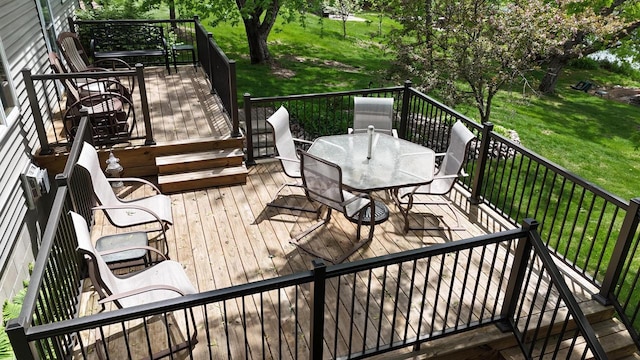 N1423 Silver Canoe Rd, Keshena, WI 54135 - deck featuring outdoor dining space and a yard