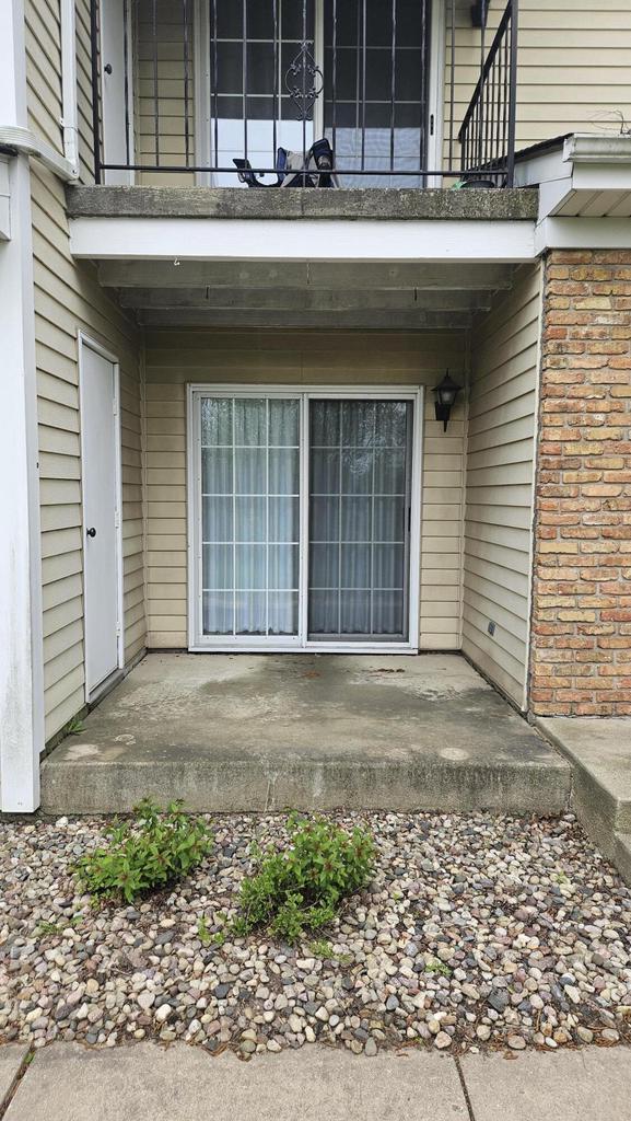 7040 Mariner Dr Unit 103, Mount Pleasant, WI 53406 - doorway to property featuring a balcony