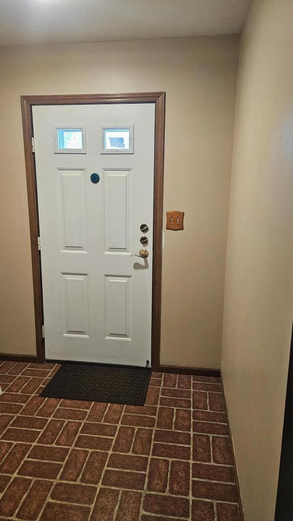 7040 Mariner Dr Unit 103, Mount Pleasant, WI 53406 - foyer entrance featuring brick patterned flooring