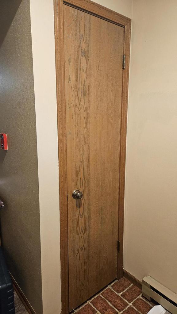 7040 Mariner Dr Unit 103, Mount Pleasant, WI 53406 - detailed view of baseboard heating and baseboards