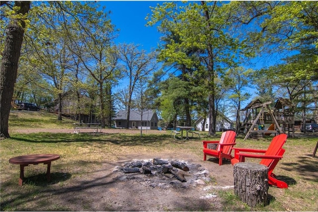 601 Idlewild St Unit 104, Balsam Lake, WI 54810 - view of yard with an outdoor fire pit and a playground