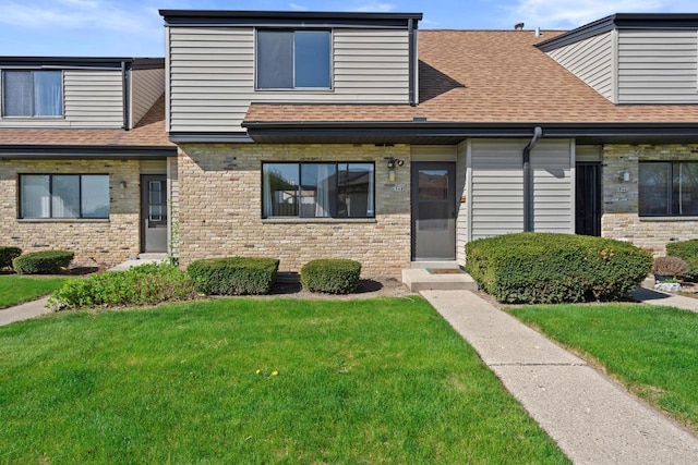 6548 N Bourbon St, Milwaukee, WI 53224 - townhome / multi-family property featuring a shingled roof, a front yard, and brick siding