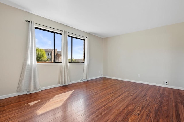 6548 N Bourbon St, Milwaukee, WI 53224 - empty room featuring baseboards and wood finished floors
